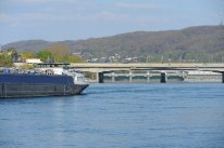 Rhein mit Frachtschiff und Kraftwerk Birsfelden